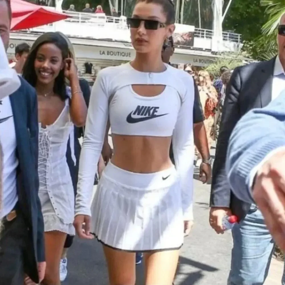 Nike White Crop Top and White Pleated Mini Skirt with Black Accents